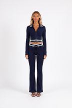 Navy striped-trim zip crop top and flared trouser set — front