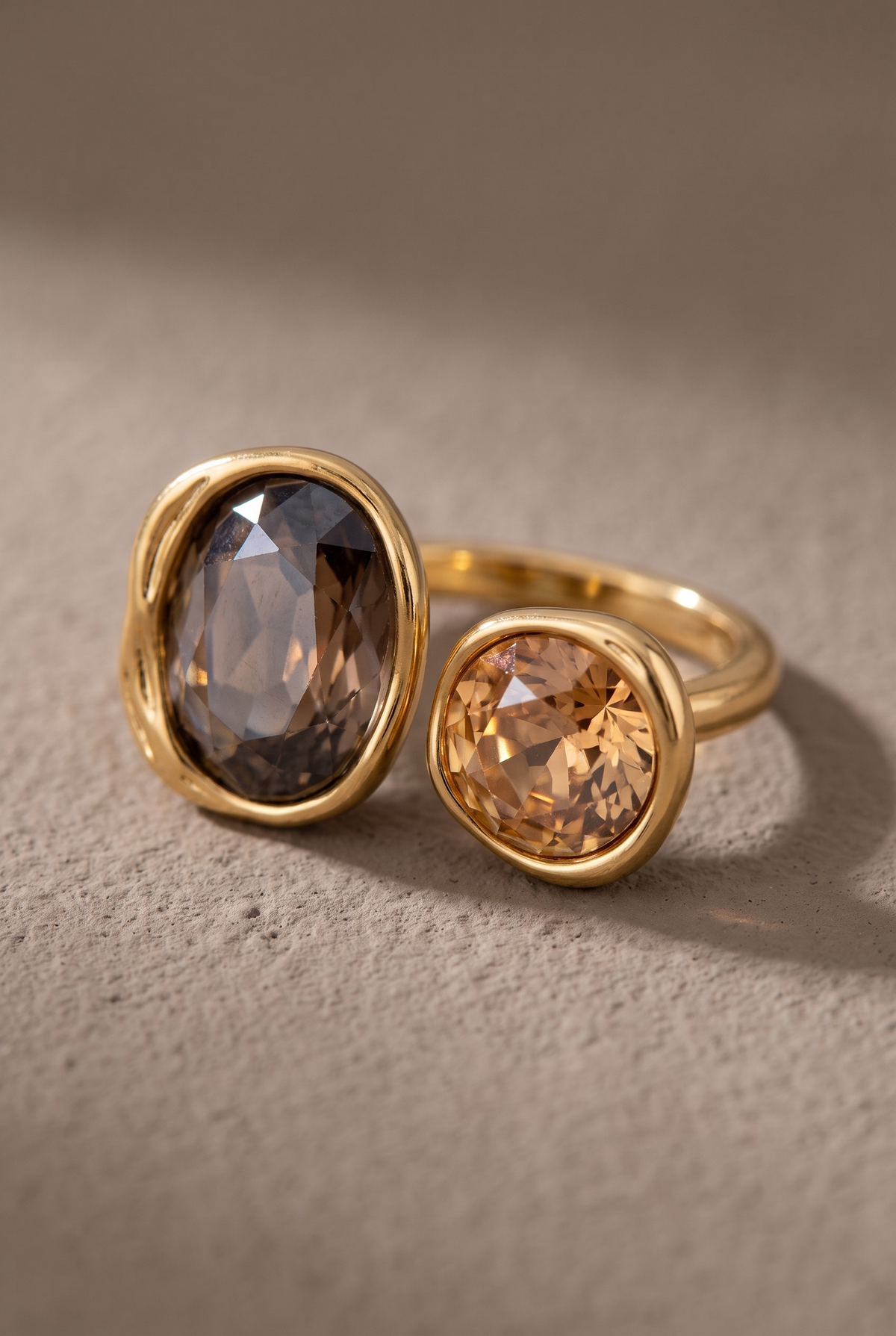 Close-up of the smoky oval and champagne round crystals in organic bezels