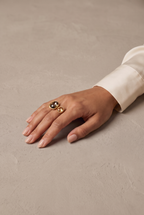 Two-stone open crystal ring in gold worn on the hand
