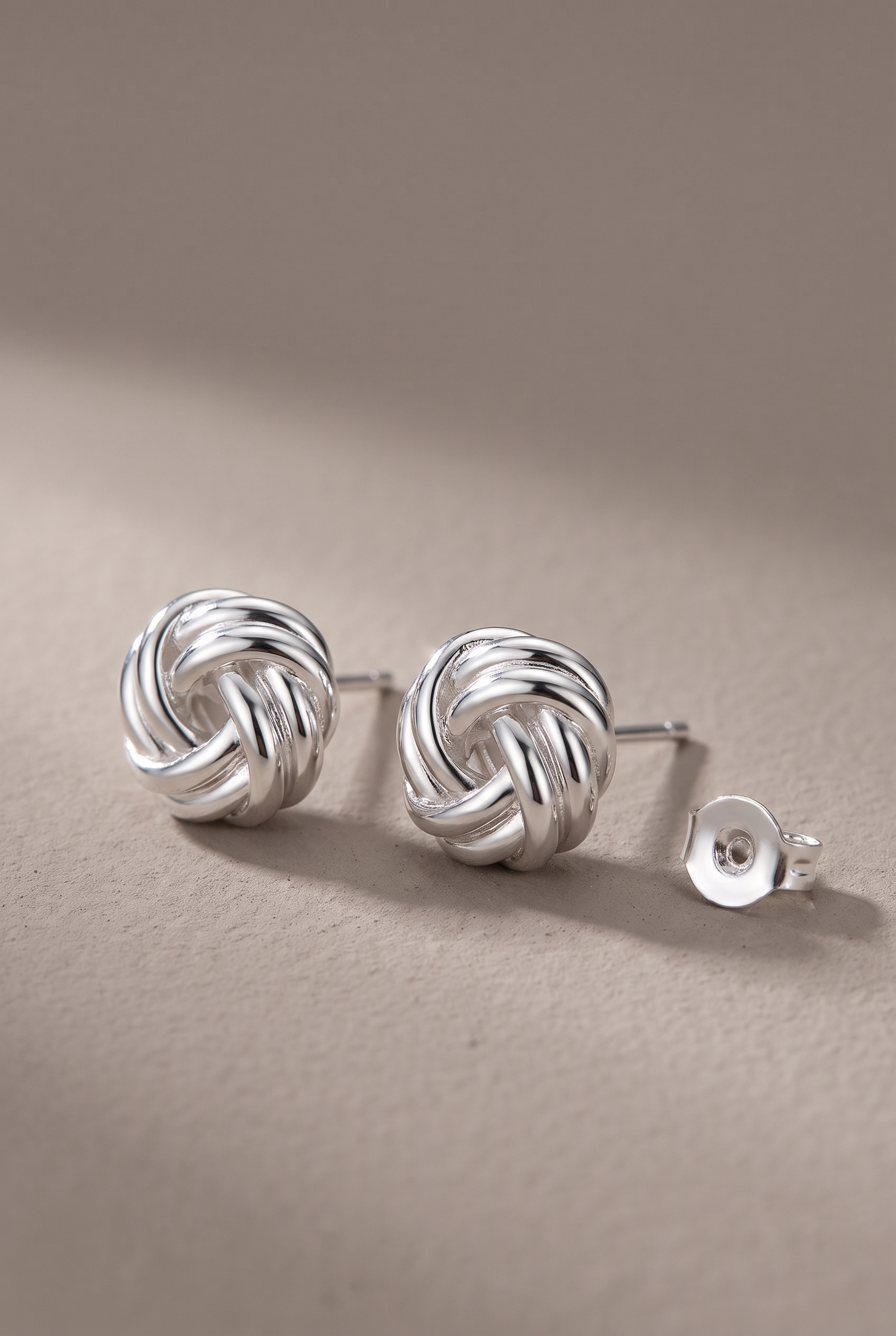 DropIQ silver-tone love-knot stud earrings